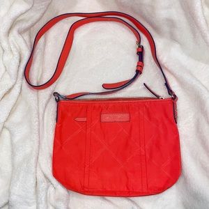 Vera Bradley orange purse, with a little discoloration on the backside